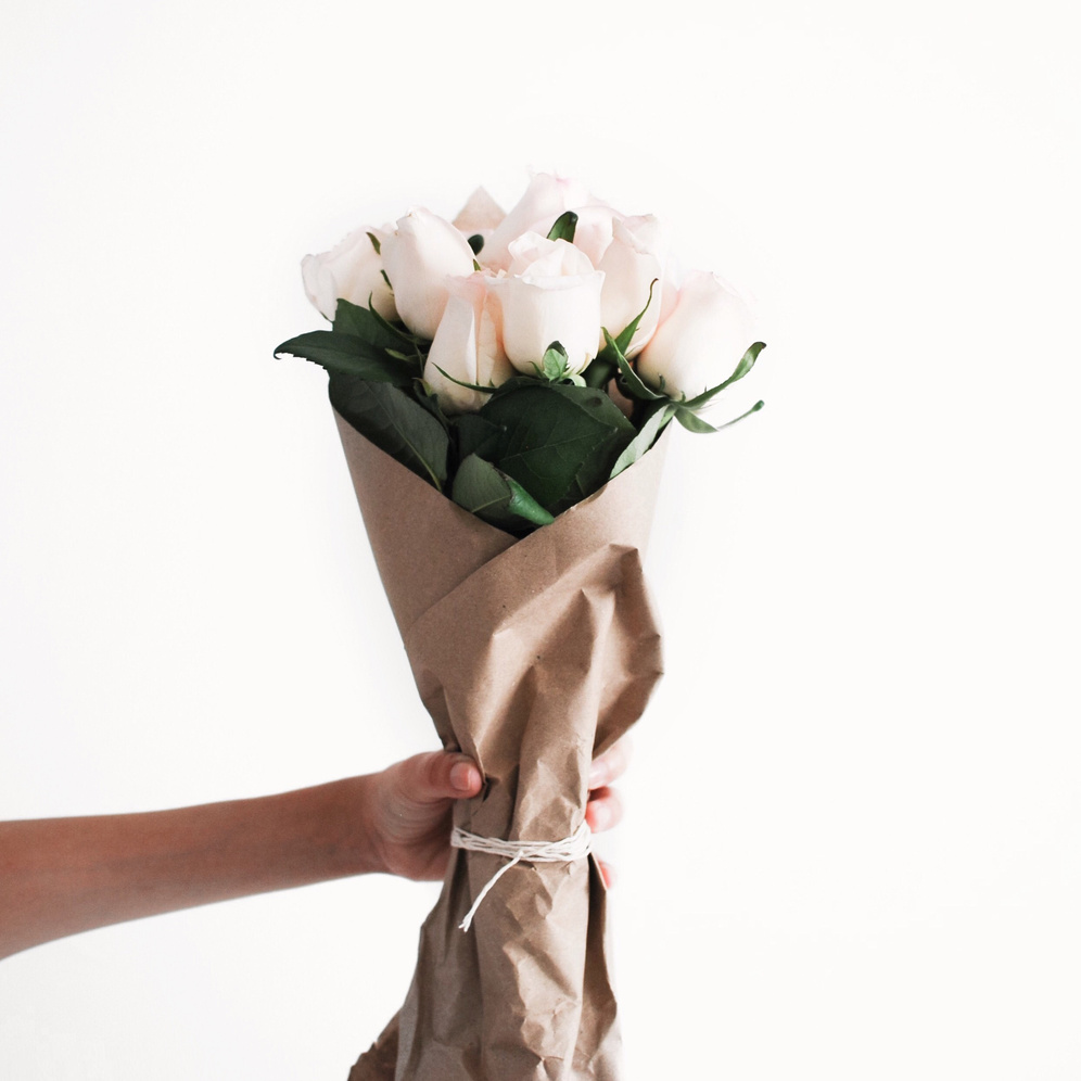 Holding flower bouquet